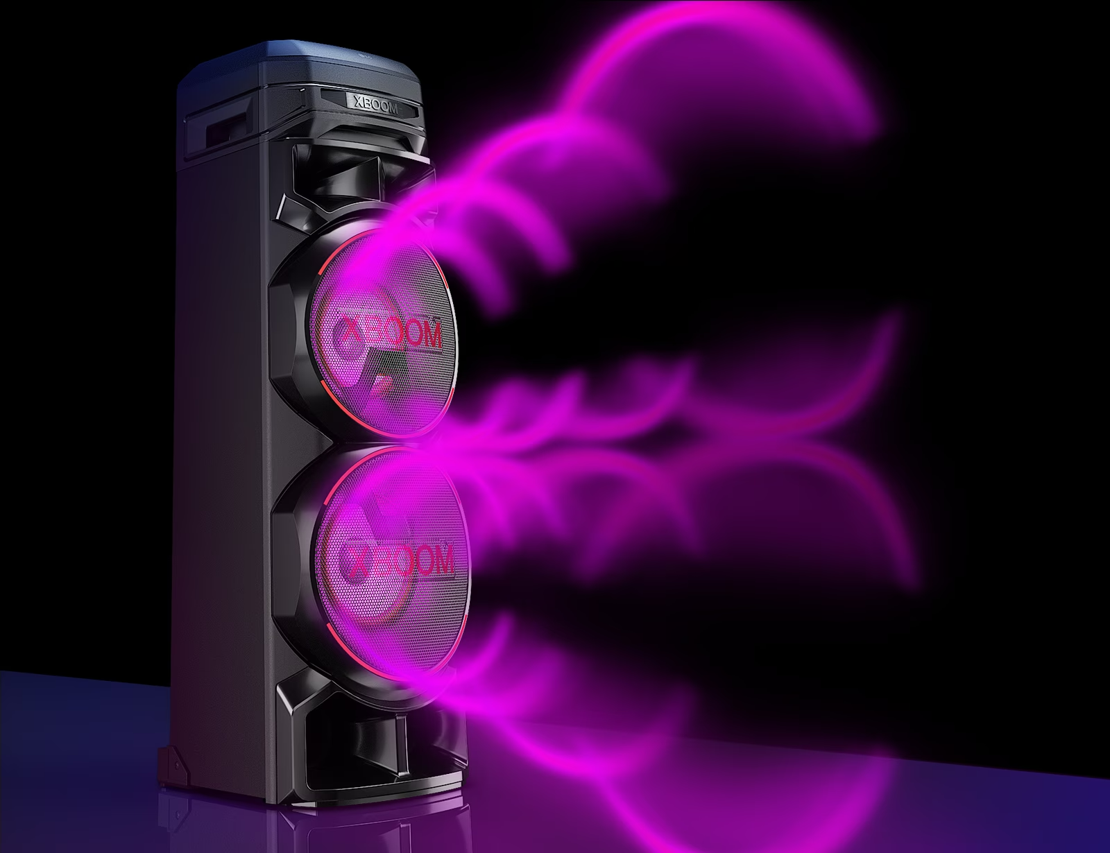 LG RNC9 LG XBOOM RNC9 with a left side forward against a black background. The purple circular sound graphic comes out from the woofers. 